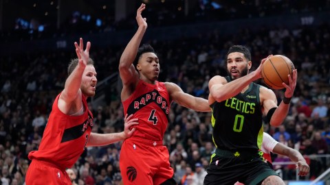 Boston Celtics forward Jayson Tatum and Toronto Raptors teammates Scottie Barnes and Jakob Poeltl