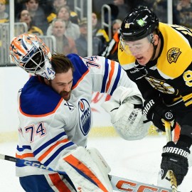 Boston Bruins defenseman Nikita Zadorov and Edmonton Oilers goaltender Stuart Skinner