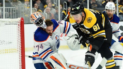 Boston Bruins defenseman Nikita Zadorov and Edmonton Oilers goaltender Stuart Skinner