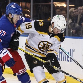 Boston Bruins forward Pavel Zacha and New York Rangers defenseman Will Borgen