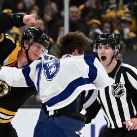 Boston Bruins forward Trent Frederic and Tampa Bay Lightning defenseman Emil Lilleberg