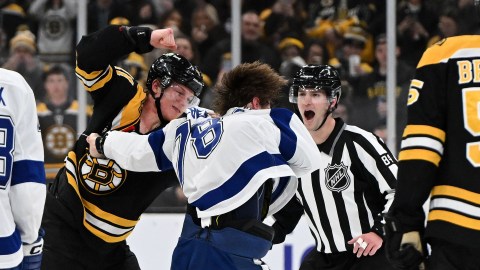 Boston Bruins forward Trent Frederic and Tampa Bay Lightning defenseman Emil Lilleberg