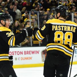 Boston Bruins forwards David Pastrnak, Morgan Geekie