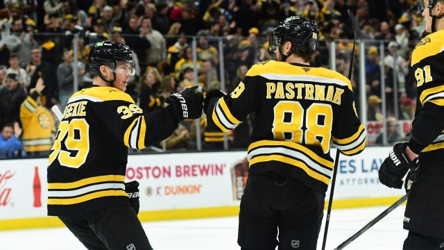 Boston Bruins forwards David Pastrnak, Morgan Geekie