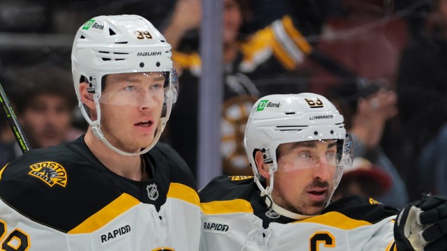 Boston Bruins forwards Morgan Geekie, Brad Marchand